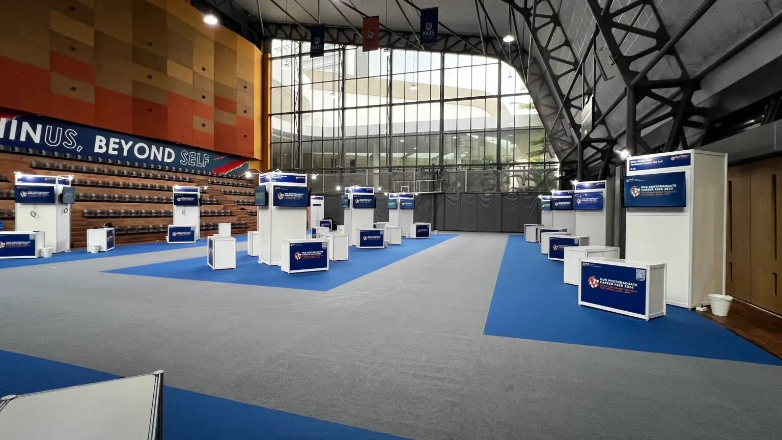 Finished TV setup at NUS Career Fair booth with standardised display system.