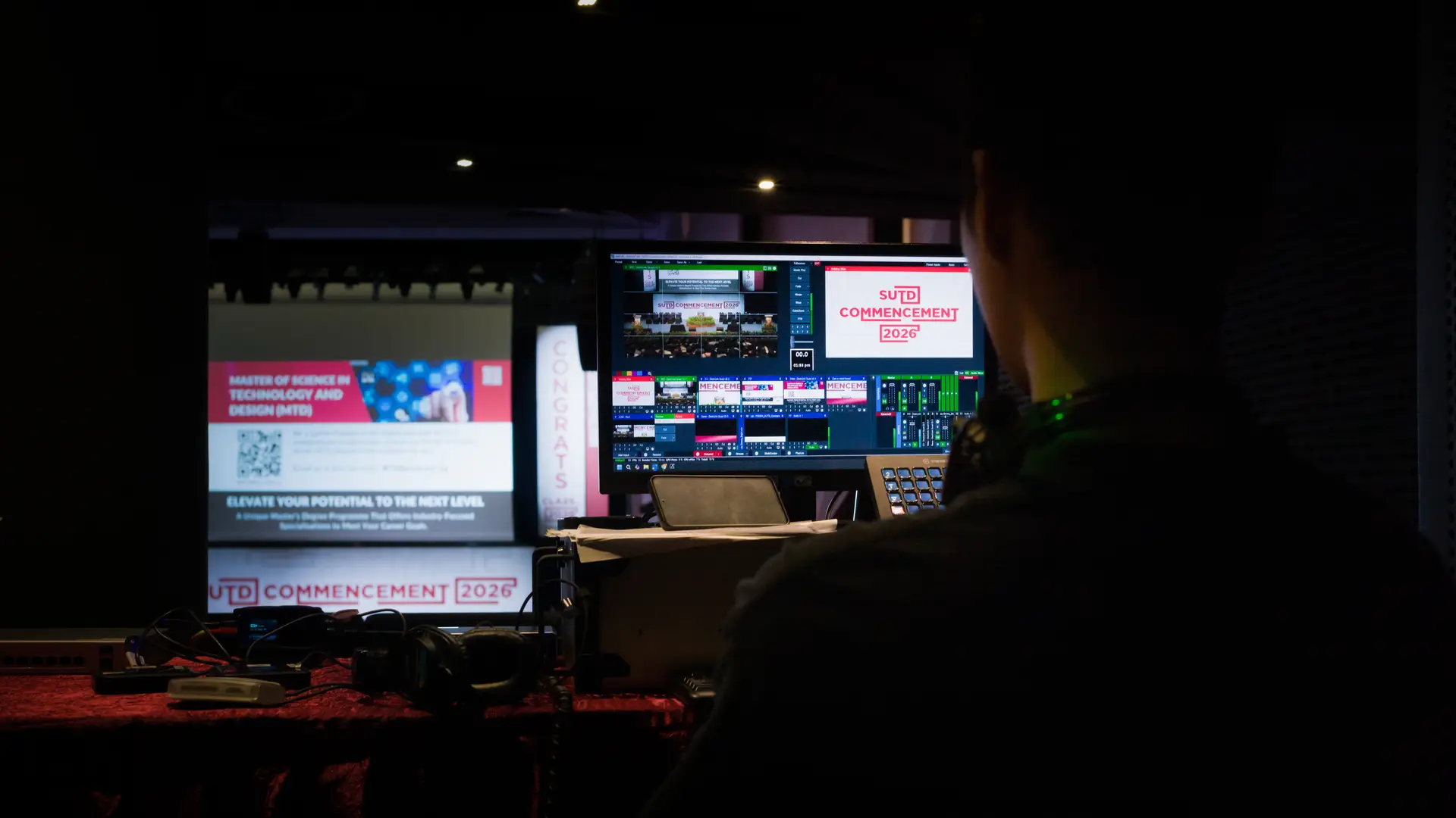Live switching, graphics, presentations and webcast delivery are coordinated from a dedicated broadcast position.